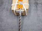 a box tied up with a rope on the floor