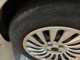 a close up of a tire on a car ' s rim