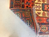 a close up of a rug on a white surface