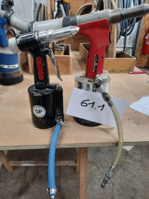 a picture of a drill and a hose on a workbench