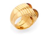 an image of a gold ring with a tiger ' s eye stone