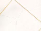 a white tile floor with a crack in the middle of it