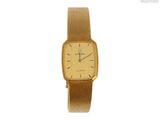une photo d'une montre en or avec un bracelet marron