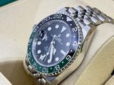 a rolex watch in a box with a watch in it