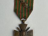 an image of a medal with a cross on it on a white surface
