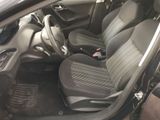 the interior of a car with two rows of seats and a steering wheel