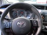 the interior of a car with a steering wheel and dashboard controls