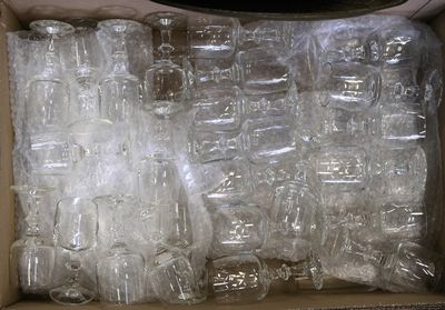 a box full of empty plastic bottles sitting on a table