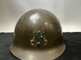 a helmet with a circuit board on it on a table