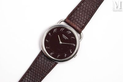 an image of a close up of a wrist watch on a white surface