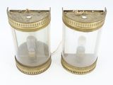 pair of antique brass and glass lamps on a white background