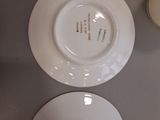 two plates and a bowl on the table