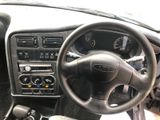 a picture of a dashboard of a car with a steering wheel
