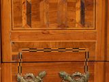 a wooden cabinet with a marble top and two drawers