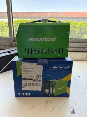 the box is open on the table next to the window