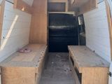 a van that has a bench in the back of it