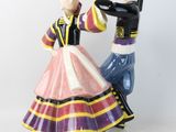 a figurine of a man and a woman dancing