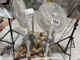 three fans that are sitting on top of a table