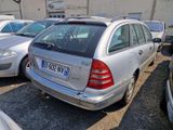 several cars parked in a parking lot with a number plate on the back of the car