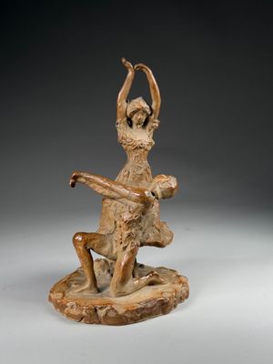 an image of a statue of a woman sitting on top of a rock