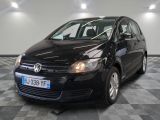 the black volkswagen b - cross is parked on a checkered floor