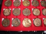 a red case with a lot of coins in it