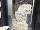 three bottles of wine that have been left on the table