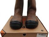 the box is full of a pair of brown leather boots