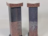 two marble pedestals on a white background