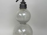 an image of a soap dispenser made of glass