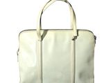 white leather handbag on a white background with the words art flow on it