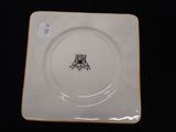 a white plate with a picture of a castle on it
