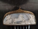 a hair comb with a picture of a horse and people on it