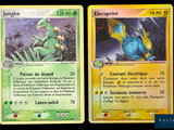 two pokemon cards with different designs on them on a black background