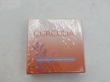 an image of a box of perfume sitting on top of a table