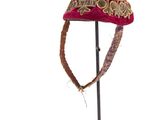a hat that is on a stand on a white background