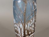 a vase that has a picture of a tree on it