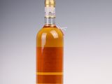 an image of a bottle of whiskey sitting on a table