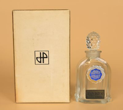 an image of a bottle of liquor next to a box