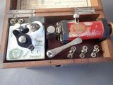 an old fashioned sewing machine that is in a wooden box