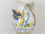 a white vase with a blue and yellow design on it
