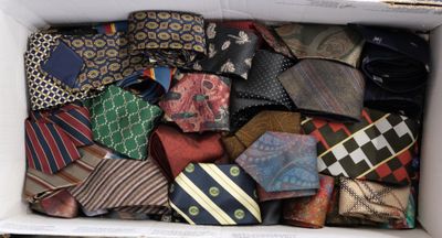 a box full of ties that are sitting on a table