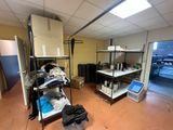 an image of a room with a lot of clothes on the shelves