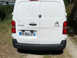 a white van that is parked on the side of the road