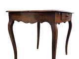 an old wooden table with a drawer on top of it