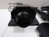 a black camera sitting on top of a white table