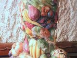 a large pile of fruit and vegetables on a wooden tray