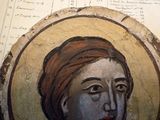 painting of a woman with a turban on a piece of wood