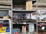 many shelves with various items on them in a garage