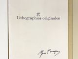 an open book with a handwritten title on the cover